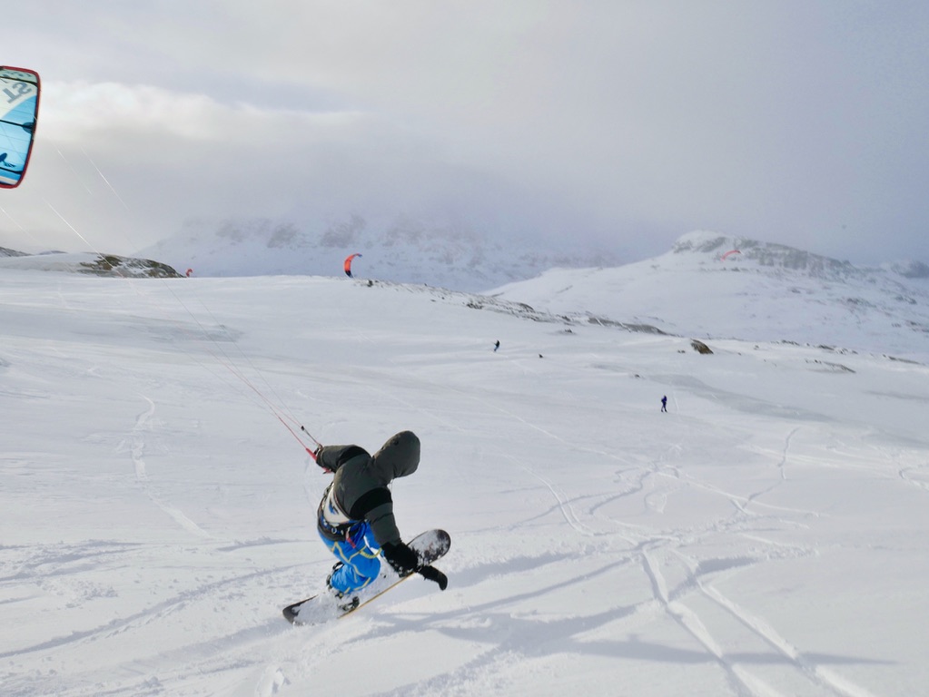 a man skiing down a snow covered slope