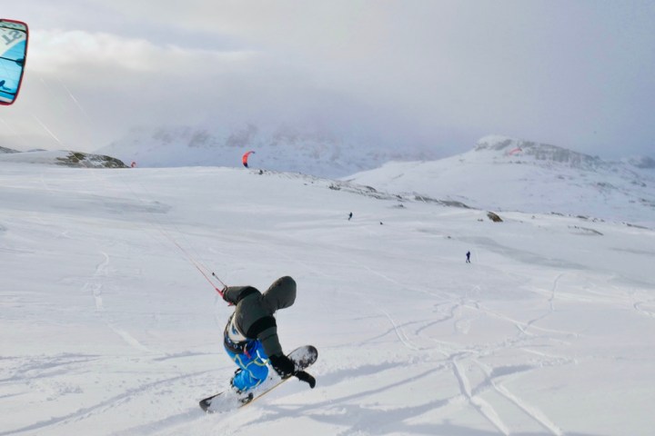 a man skiing down a snow covered slope