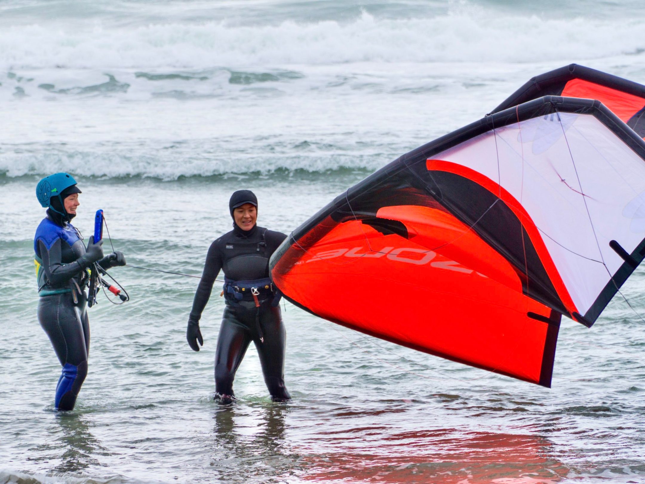 a man carrying a surf board on a body of water