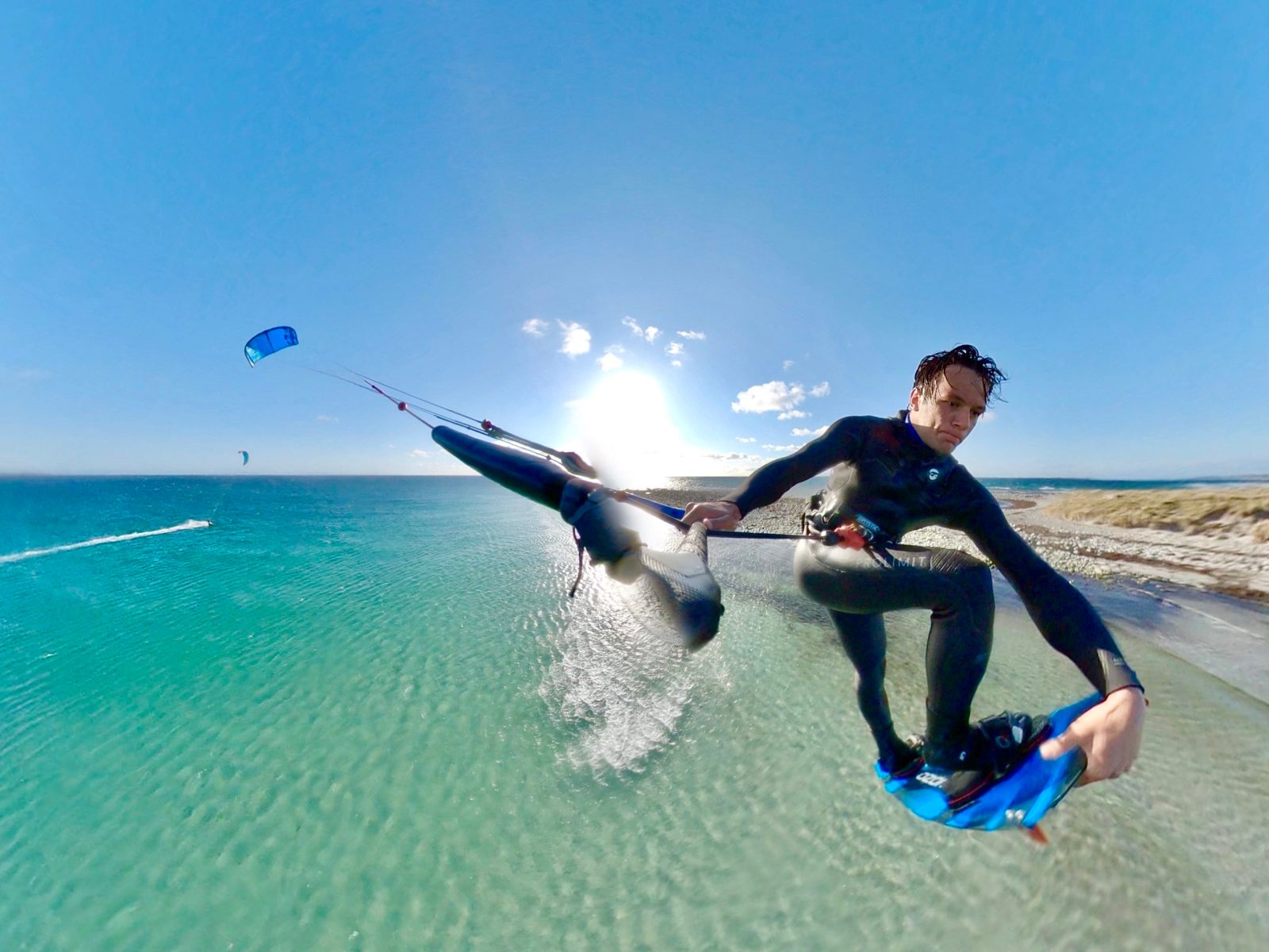 a man flying through the air while riding a surfboard in the water