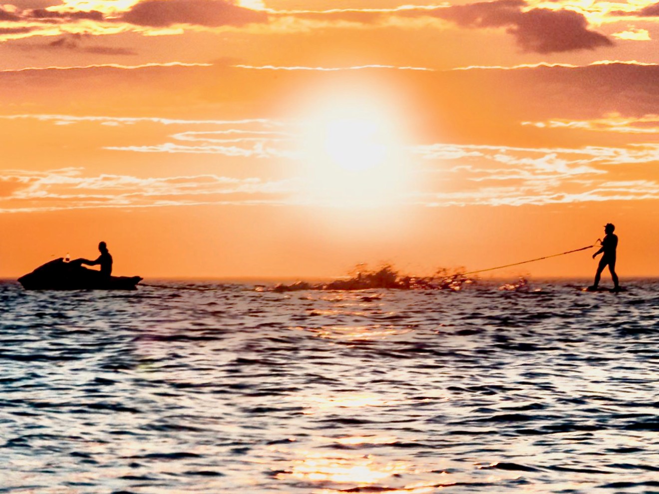 a sunset over a body of water