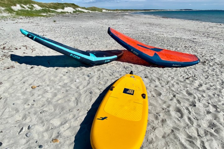 a person lying on a sandy beach