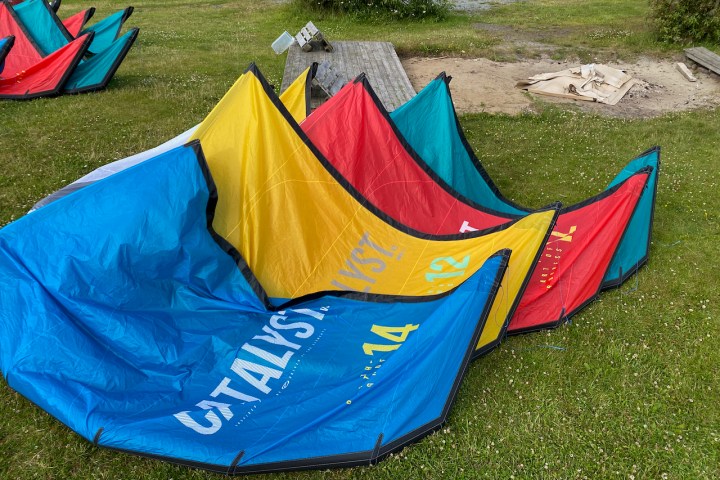 a colorful kite under a blue blanket