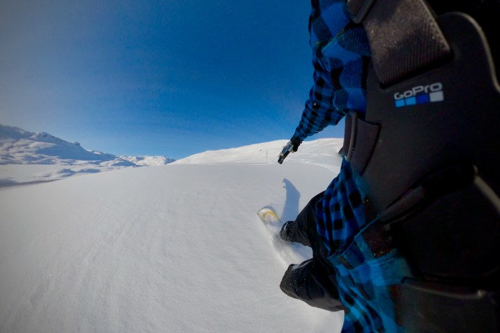 a man that is standing in the snow