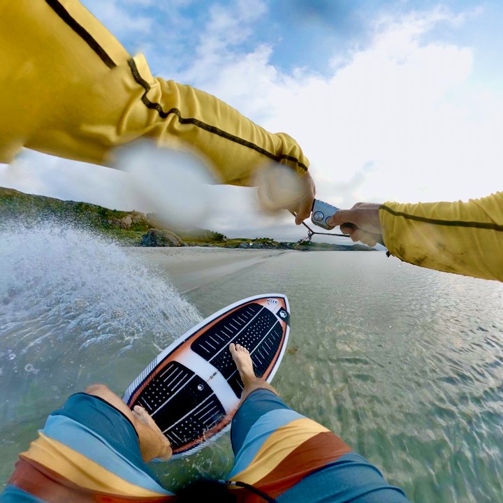a person riding a skimboard