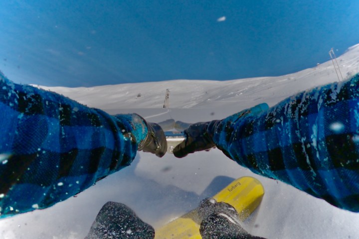 a man riding a snowboard